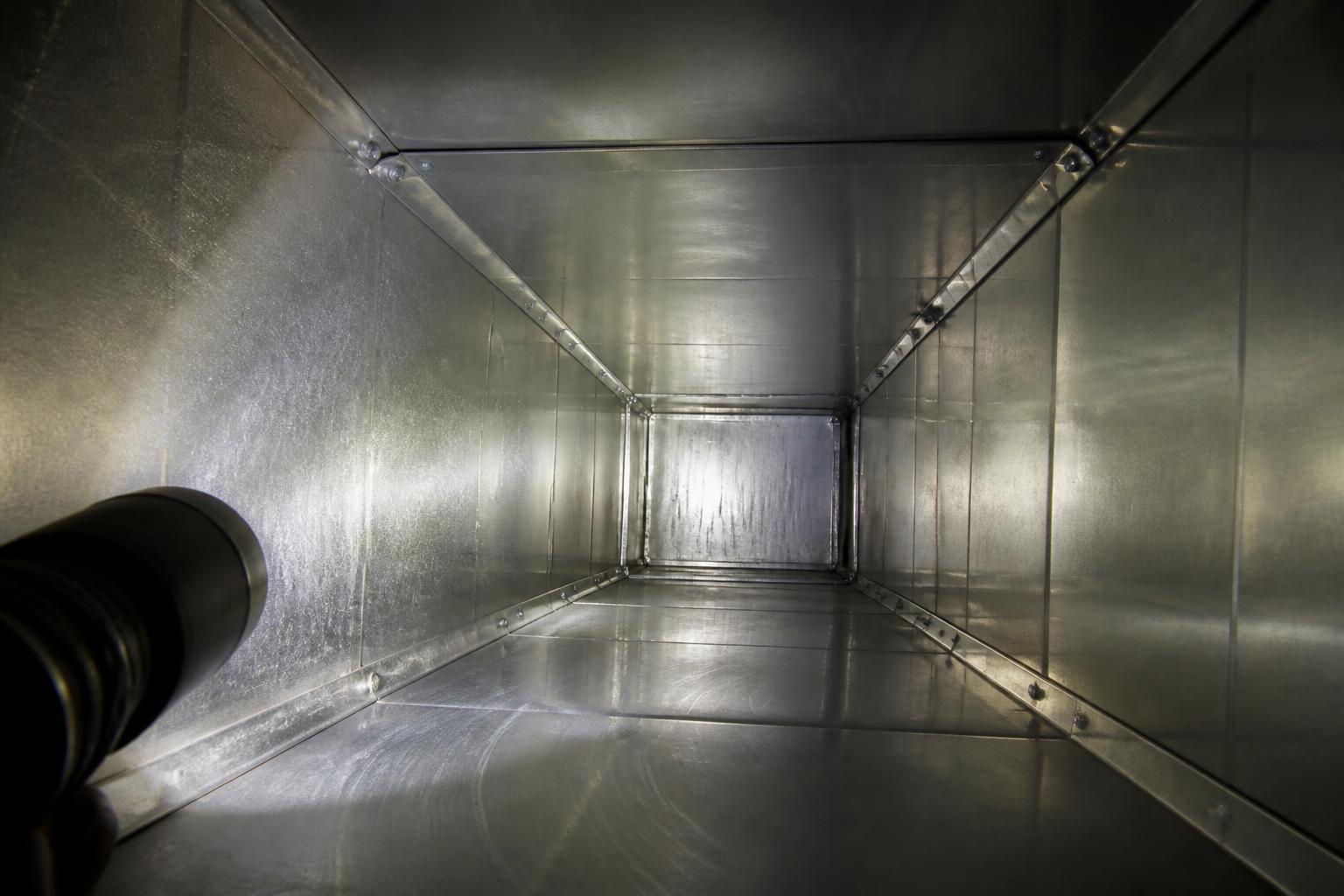 Clean galvanized air duct interior after professional cleaning