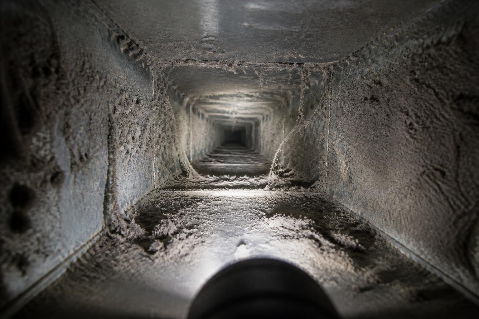 Air duct interior packed with dust before cleaning